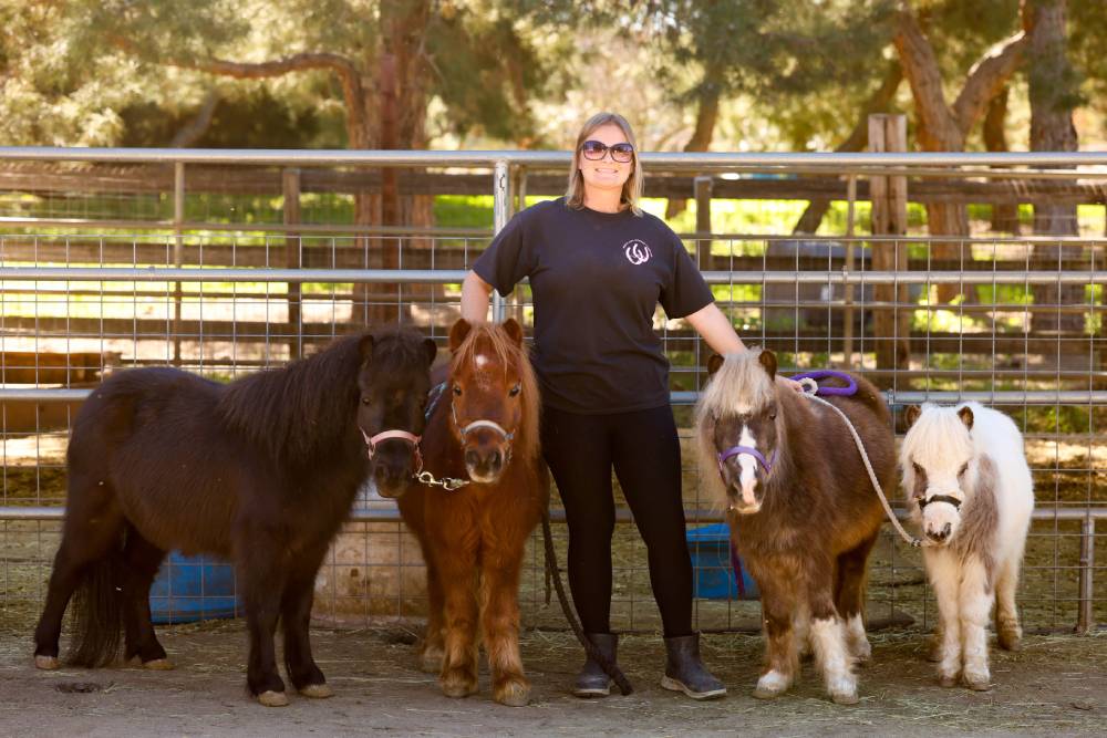 Melissa and her mini horses at Heart and Hooves Therapy